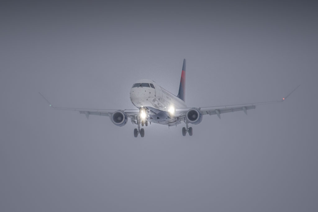 SkyWest Flight 3528 emerges from low level cloud cover at Friedman Memorial Airport (KSUN), on Sunday, Dec. 13 at 3:08 p.m. The flight, originating from Salt Lake City, was the first SkyWest Embraer 175 flight to land using SUN’s new proprietary approach procedure. (KSUN PHOTO BY: Tim Burke)