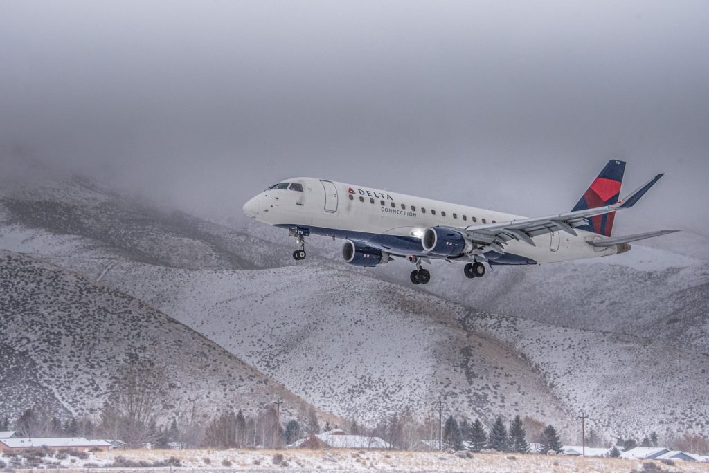 SkyWest Flight 3528 emerges from low level cloud cover at Friedman Memorial Airport (KSUN), on Sunday, Dec. 13 at 3:08 p.m. The flight, originating from Salt Lake City, was the first SkyWest Embraer 175 flight to land using SUN’s new proprietary approach procedure. (KSUN PHOTO BY: Tim Burke)
